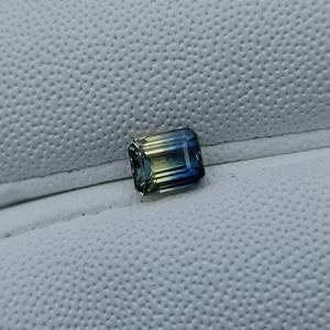 lot 4 image: 1.07 Carat Natural Parti Sapphire, Emerald Cut Retail Value Approximately $2,500 VIDEO