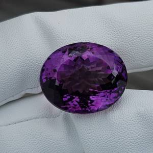 lot 15 image: MASSIVE Purple Rain 56.40 Carat Natural Amethyst, Oval Cut Retail Value Approximately $2,820 VIDEO