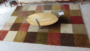 lot 23 image: Oval Coffee Table and Rug