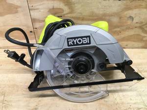 lot 27 image: RYOBI 13 Amp Corded 7-14 in. Circular Saw Model # CSB125