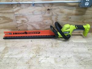 lot 37 image: RYOBI ONE 18V 22 in. Lithium-Ion Cordless Hedge Trimmer Model # P2609VNM - Tool Only