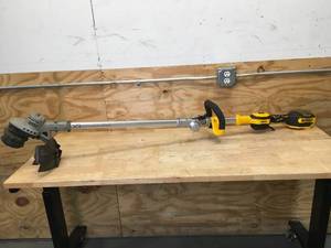 lot 74 image: DEWALT 20V MAX 14 in. Brushless Cordless Battery Powered Foldable String Trimmer Model # DCST922 - Tool Only