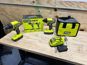 lot 153 image: RYOBI ONE 18V Cordless 2-Tool Combo Kit with DrillDriver, Impact Driver, (2) 1.5 Ah Batteries, and Charger