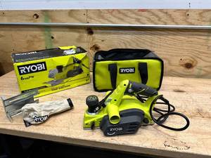 lot 194 image: RYOBI 6 Amp Corded 3-14 in. Hand Planer with Dust Bag