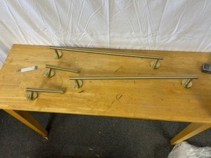 lot 49 image: Gold - 2 Toilet Paper holder, 2 Towel holder. Clips no screws