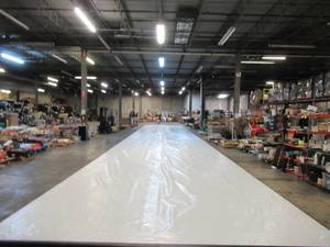 lot 212 image: NEW Vinyl Tarp - 16.33 x 100  Black  White Vinyl tarp - 9 oz. Lightweight Duty