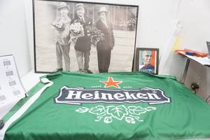 lot 57 image: Heineken Flag, Smeeeg Head and 3 stooges framed poster