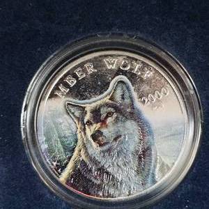 lot 28 image: 1 oz SilverColored Wolf Coin