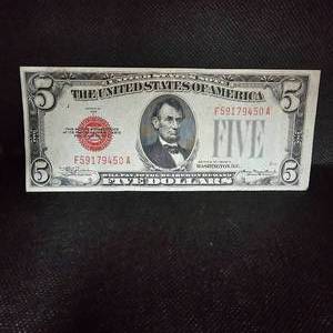 lot 104 image: 1928 C $5 US Red Seal Note