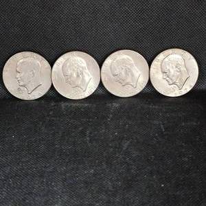 lot 128 image: 4-Ike Dollars