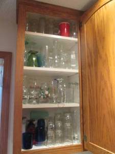 lot 107 image: Cupboard filled with all kinds of glasses
