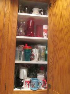 lot 108 image: Deep cupboard filled with mugs, win...