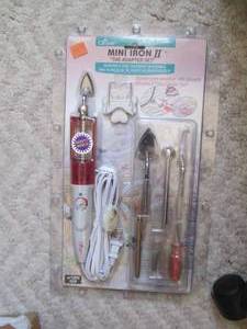 lot 12 image: New in package Mini Iron the adapt...
