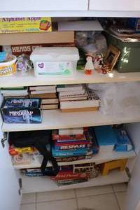 lot 209 image: 4 shelves full of misc board games,...