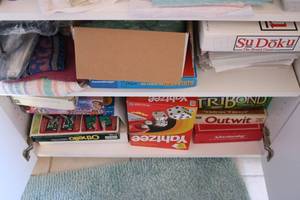 lot 217 image: 2 shelves of misc board games and m...