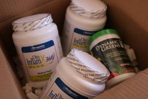 lot 233 image: box of digestive supplements tropic...