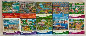 lot 43 image: Mega Puzzles 1000pc Puzzles - Bundle of 10 Hometown Collection