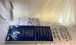 lot 55 image: Sew Perfect Cutting Board 36 x 72, Titanium Ironing Blanket and TaoTronics LED Desk Lamp