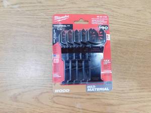lot 184 image: NEW - Milwaukee 1-38 in. Multi-Tool Oscillating Blade Set (5-Piece)