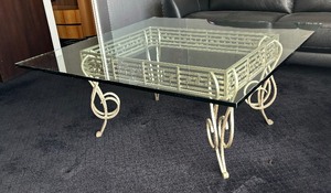 lot 137 image: Elegant Metal Base Glass Top Music Note Motif Coffee Table