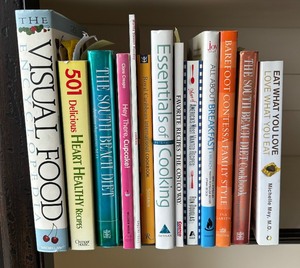 lot 224 image: Variety of Cookbooks including The South Beach Diet, Eat What You Love, Essentials of Cooking and More