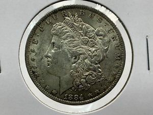 lot 105 image: 1884-O Morgan Dollar