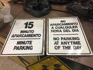 lot 319 image: 2 Bi-lingual Metal Parking Signs - 18 x 24