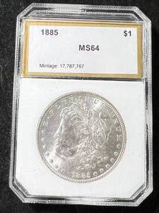 lot 06 image: 1885 US MORGAN SILVER DOLLAR SLABBED MS64