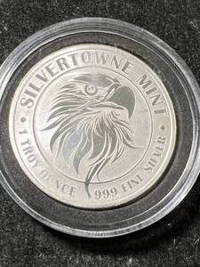 lot 34 image: 1 TROY OZ .999 FINE SILVER SILVERTOWNE MINT ROUND IN AIRTITE