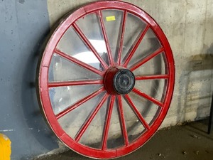 Real wagon wheel with plexiglass panes approximately 4 feet high heavy