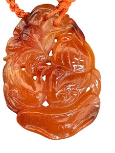 lot 32G image: Vintage Heavily Carved Stone Pendant on Braided Cord