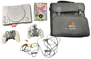 lot 384 image: Sony PS1 Playstation 1 Console, 2-Controller, Power CordsCables, 1 game -SpiderMan 2 and Carrying Case