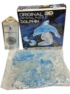 lot 526 image: Original 3D Crystal Puzzle of a Dolphin  Optical Illusion Puzzle in a Tin