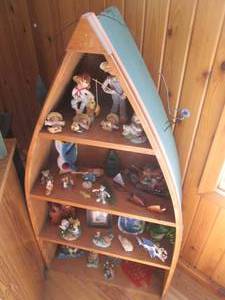 Quality wood Canoe shelf with misc ...