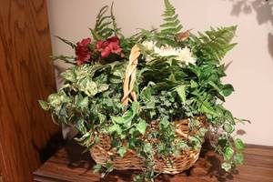 lot 672 image: Huge floral display in wicker baske...