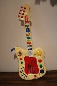 lot 674 image: PLAYSKOOL teachin tunes kids guitar...