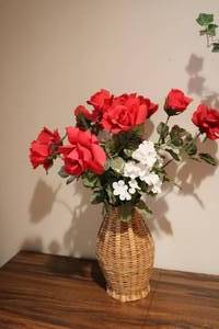 lot 700 image: Artificial flower display in wicker...