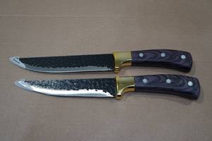 lot 45 image: 2 Carbon Steel Viking Co Hammered 11 Knives