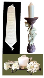 lot 21 image: Decorative Cherub Candle Holder, Centerpiece Candle & Cream Colored Table Runner