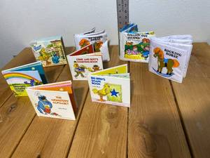 lot 40-B2025 image: (3) Vintage Vinyl Puff Baby Books and (1) Vintage Sesame Street 4 Little Books in Box