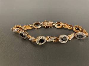 lot 16R image: Elegant Gold Over Sterling SIlver Bracelet with Black Oval Stones