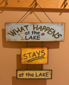 lot 124 image: What Happens at the Lake Stays at the Lake Metal Sign