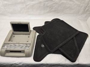 lot 108 image: Floor Mats And Used Flip down TV for Full Size GMGMC SUV 2007-2014