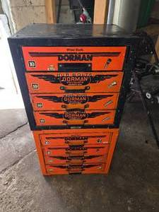 lot 26 image: (2) Dorman 4 Drawer Storage Cabinets With Misc. Size Lug Nuts