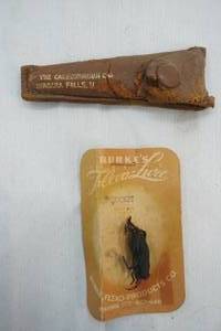 lot 596 image: Vintage Fishing Cricket and hook sharpener in sheath
