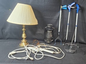 lot 181 image: Home Essentials Lot Brass Tone Lamp, Lantern, Grabbers, and Power Strips