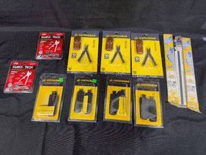 lot 235 image: Lot of Leatherman Micra Multitools, SwissTech Utili-Key Tools, and 12-inch Grid Rulers