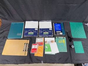lot 239 image: Collection of Office and School Supplies Including Notebooks, Legal Pads, and Cutting Mats