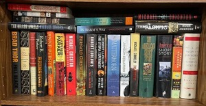 lot 337 image: Collection of Hardcover and Paperback Books Featuring Popular Authors