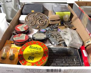lot 435 image: GE Medallion  Mixed Lot of Household Items Including Electrical Tape, Keychains, and Accessories